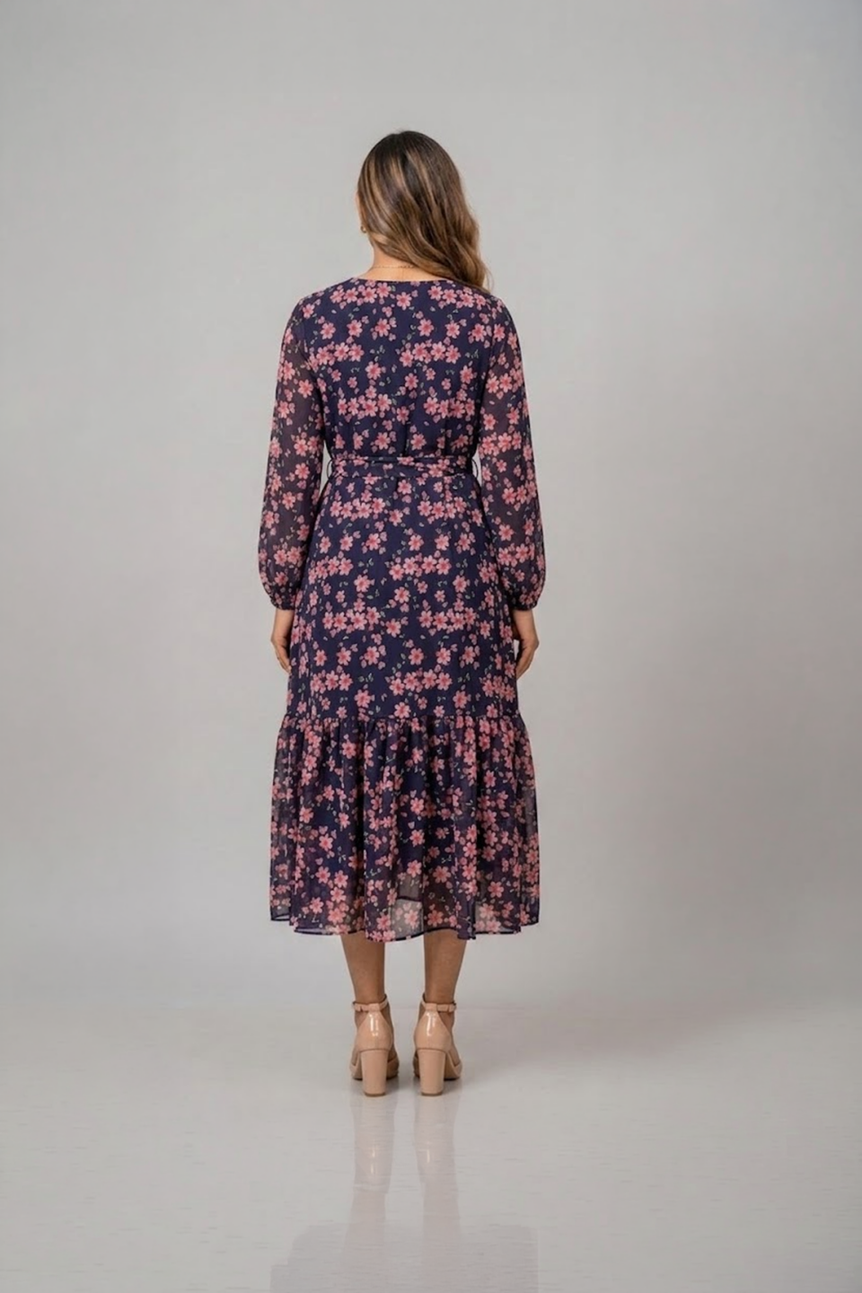 Navy blue floral ruffle midi dress with pink flower print, long sleeves and a tie-up waist