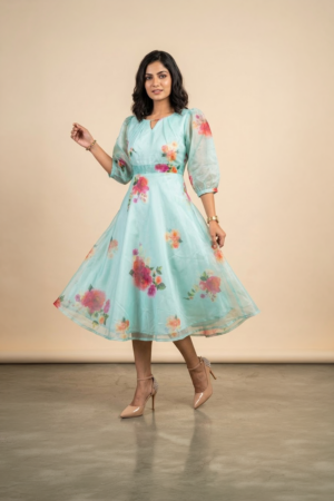 Woman wearing a Blossom Breeze Party Wear midi dress with puff sleeves and an A-line silhouette