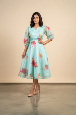 Woman wearing a Blossom Breeze Party Wear midi dress with puff sleeves and an A-line silhouette