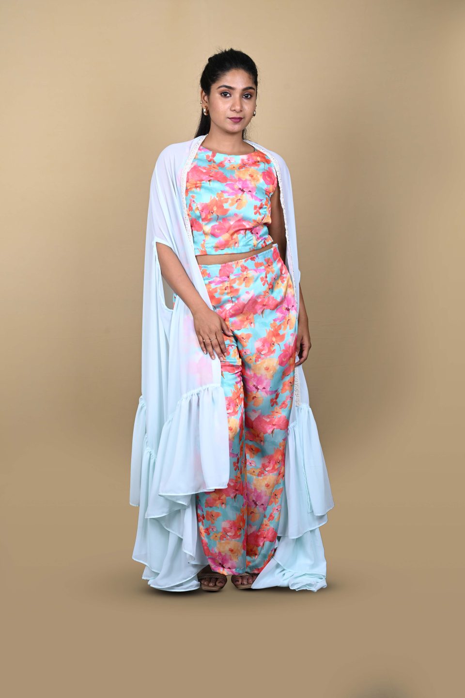 Model in Aqua Bloom Pant Set with flowing georgette cape