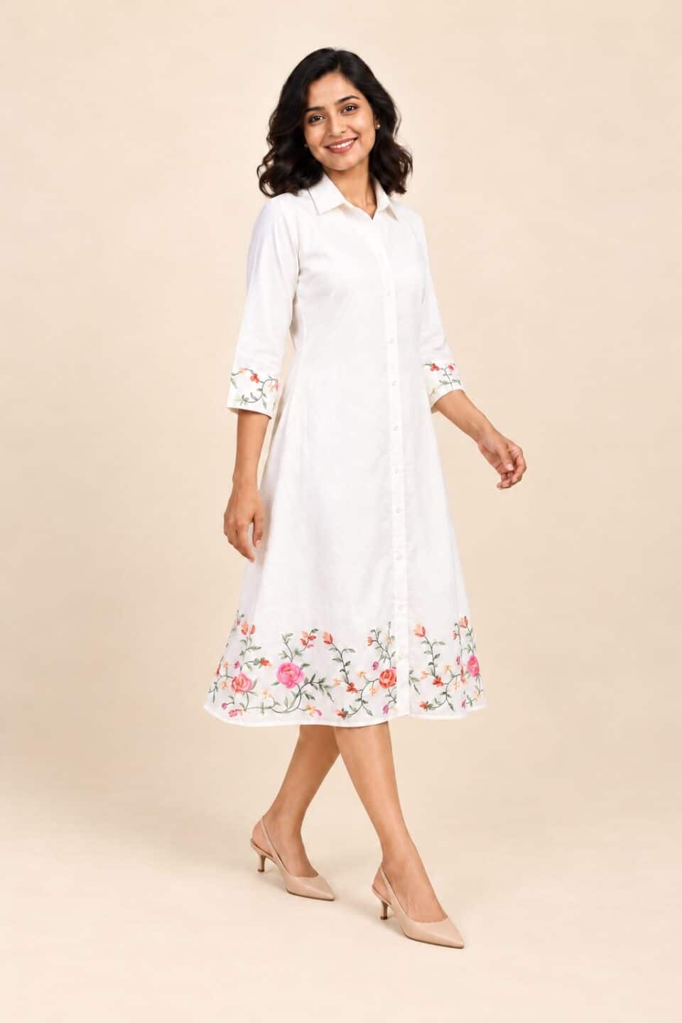 Ivory floral embroidered shirt dress, full-length three-quarter walking view with nude slingbacks