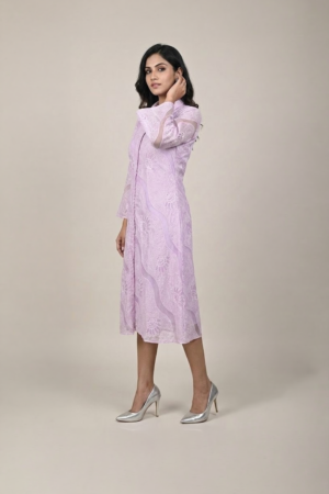 Woman wearing a lavender shirt-style midi dress with embroidered cutwork, button-down front and flared three-quarter sleeves