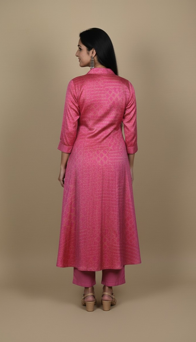 Pink button down kurta paired with matching pants, worn by a woman standing against a neutral background.