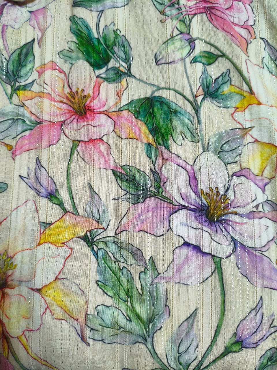 Floral high low dress for women worn by a model, front view, neutral background.