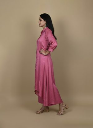 Pink button down kurta paired with matching pants, worn by a woman standing against a neutral background.