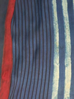 Model wearing an Indigo Handloom Co-ord Set featuring a sleeveless floral-printed vest and striped long skirt, handcrafted in cotton from Ivory by Radhika.