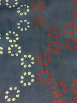 Model wearing an Indigo Handloom Co-ord Set featuring a sleeveless floral-printed vest and striped long skirt, handcrafted in cotton from Ivory by Radhika.