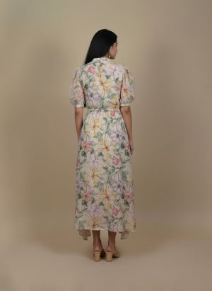 Back view of floral high low dress with flowy high low hem.