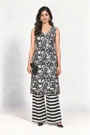 Black and white botanical-print sleeveless kurta with striped palazzo trousers, full-length front view