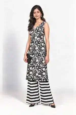 Black and white botanical-print sleeveless kurta with striped palazzo trousers, three-quarter view
