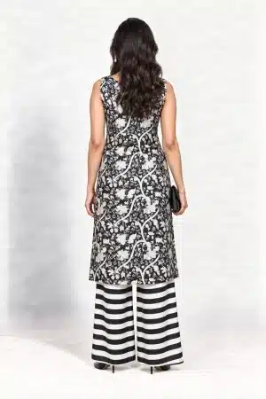 Black and white botanical-print sleeveless kurta with striped palazzo trousers, full-length back view