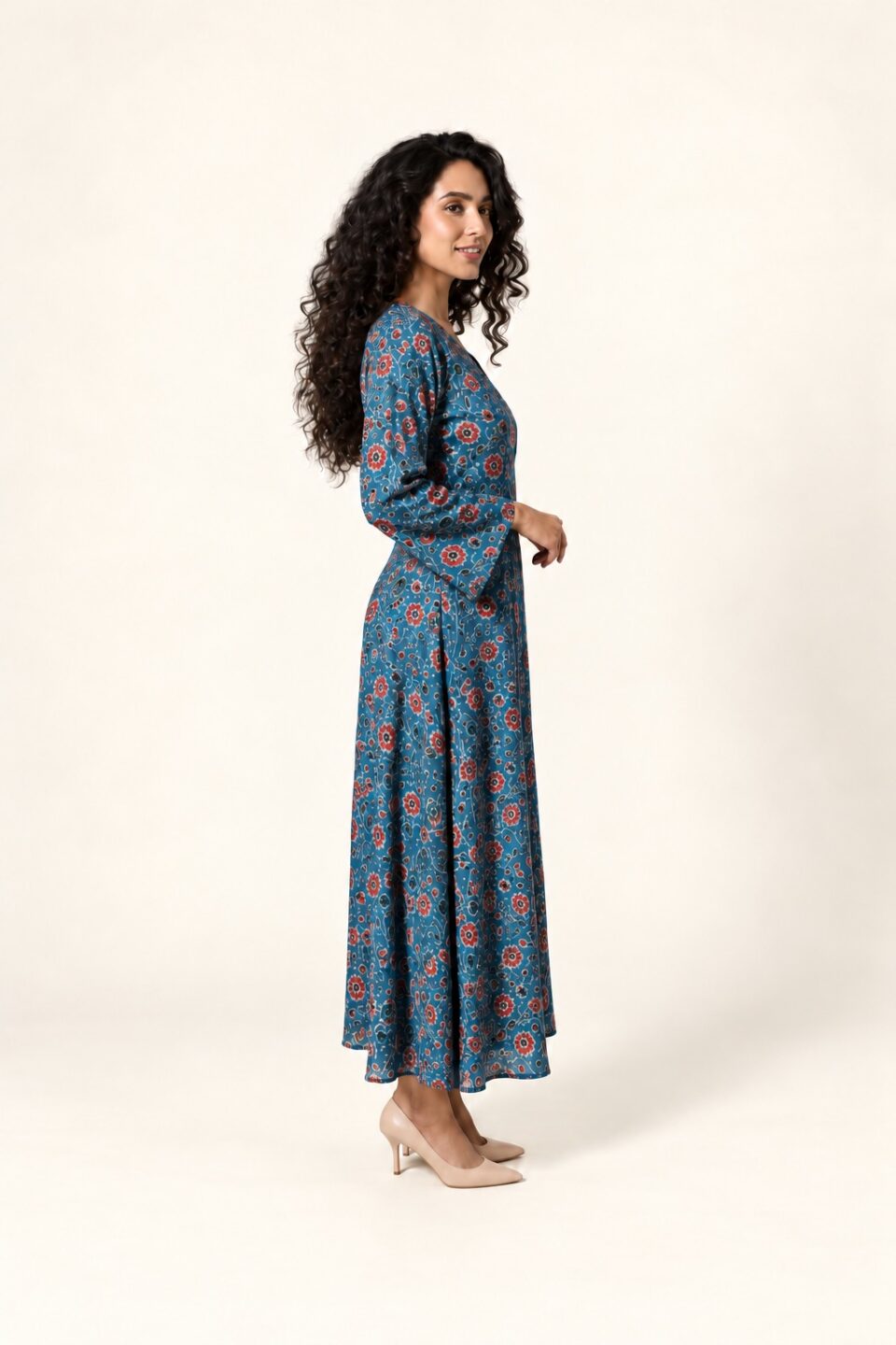 Blue floral Ajrakh maxi dress with red motifs, full-length side view with nude-beige heels