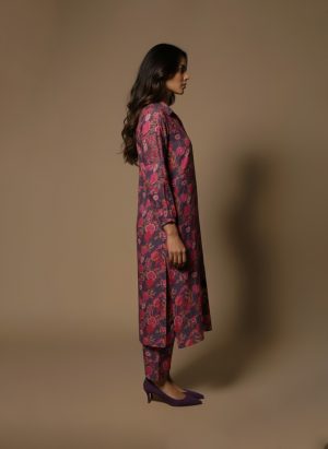 Model wearing Plum Floral Kurta Set from ivory by radhika, a cotton outfit featuring elegant plum and crimson floral prints with matching pants.