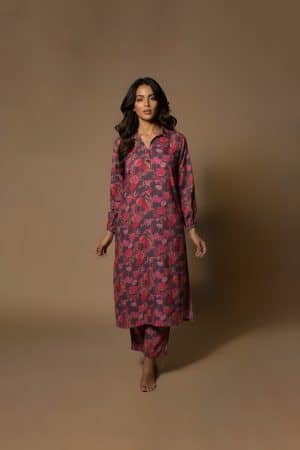 Model wearing Plum Floral Kurta Set from ivory by radhika, a cotton outfit featuring elegant plum and crimson floral prints with matching pants.