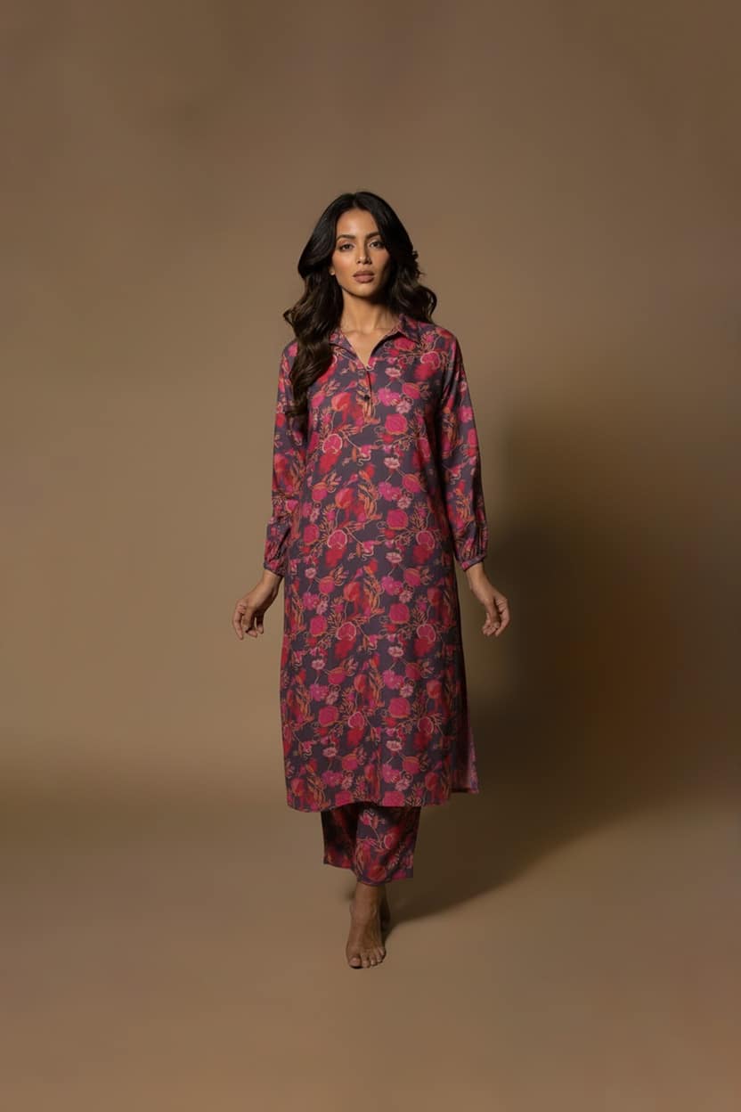 Model wearing Plum Floral Kurta Set from ivory by radhika, a cotton outfit featuring elegant plum and crimson floral prints with matching pants.