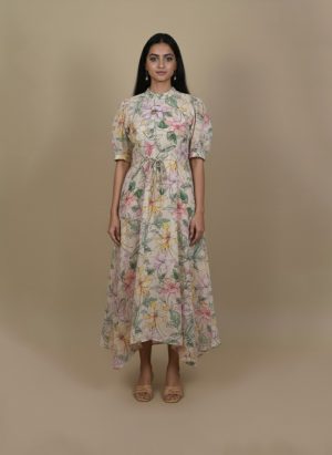 Back view of floral high low dress with flowy high low hem.