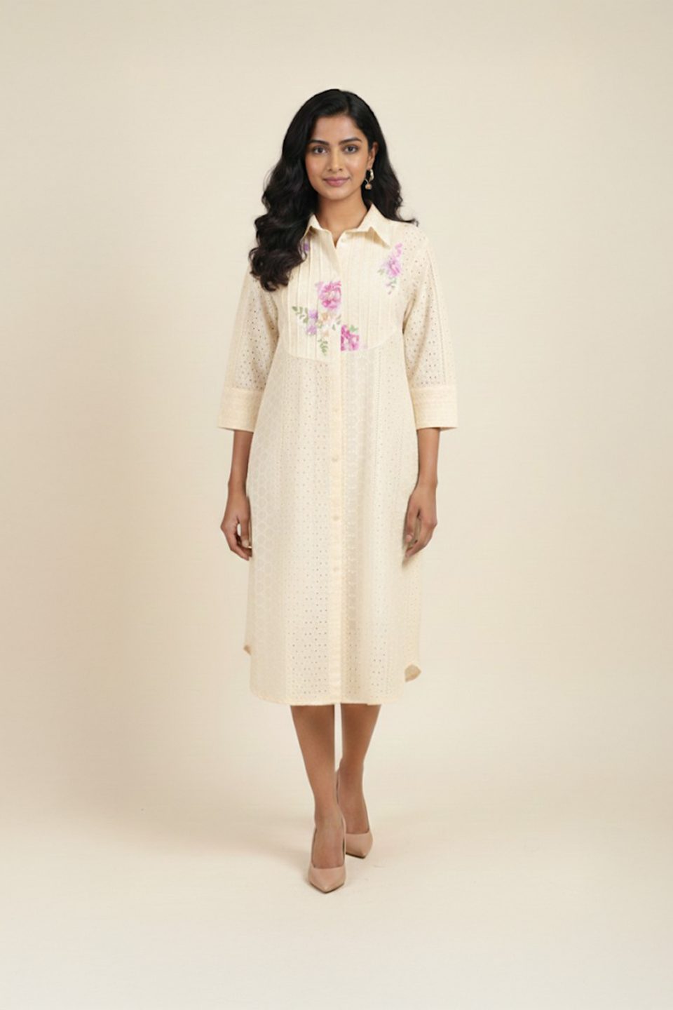 Woman wearing cream floral shirt dress with embroidered flowers – elegant women’s day dress