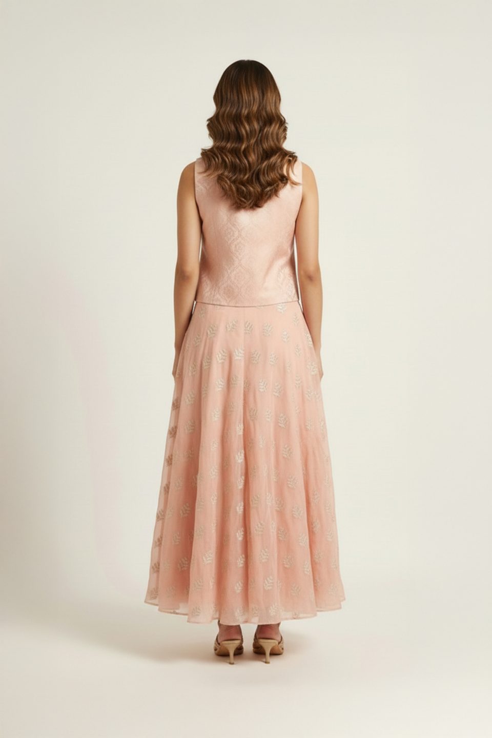 Peach embroidered jacket lehenga set with sleeveless V-neck jacket and flared lehenga