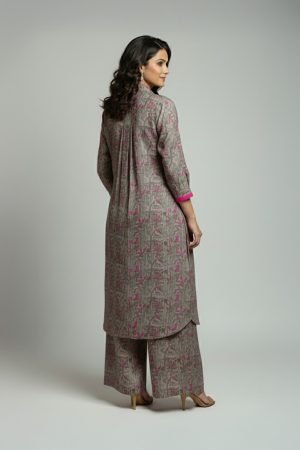 Woman wearing grey pink printed kurta set with long kurta and wide-leg pants