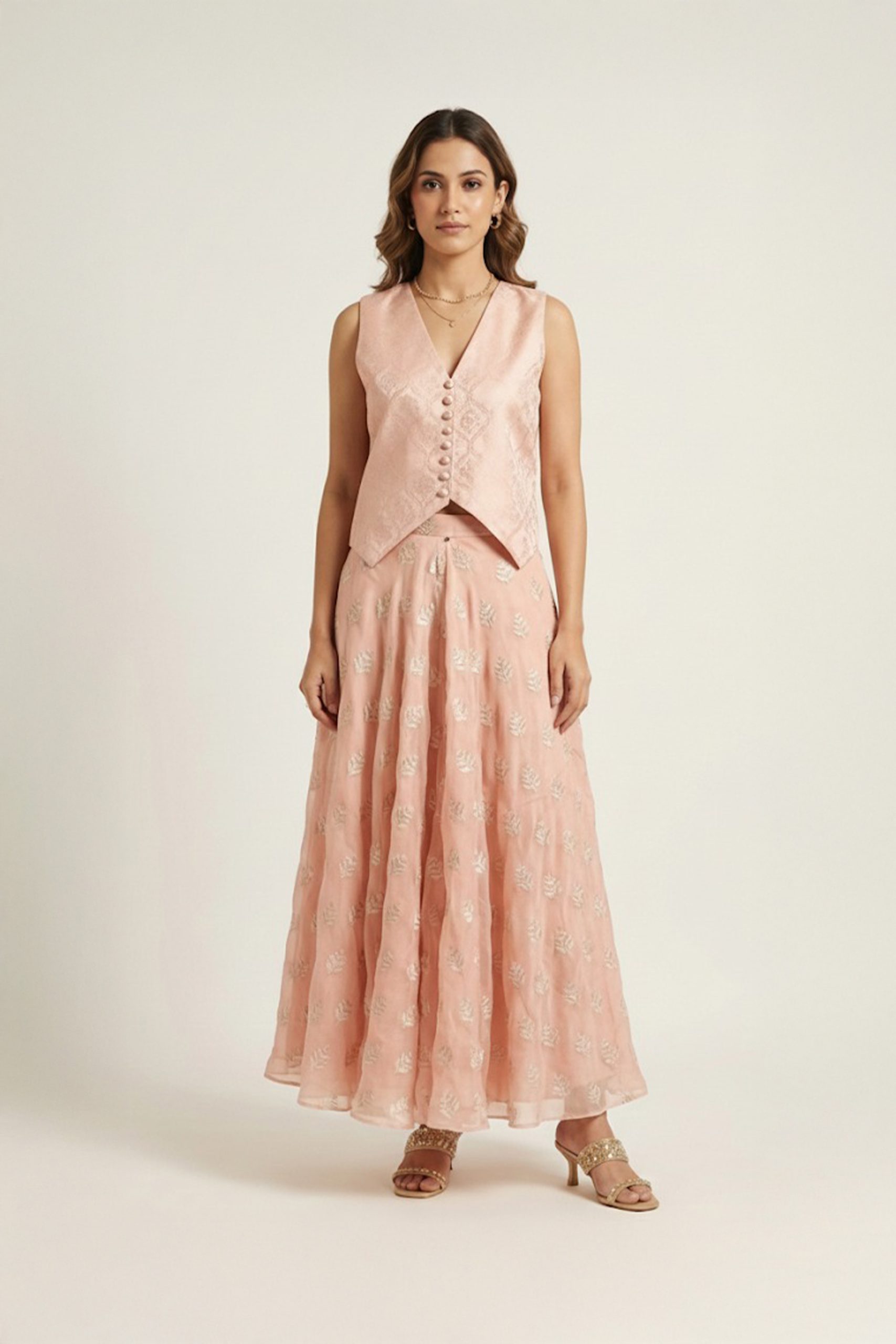 Peach embroidered jacket lehenga set with sleeveless V-neck jacket and flared lehenga