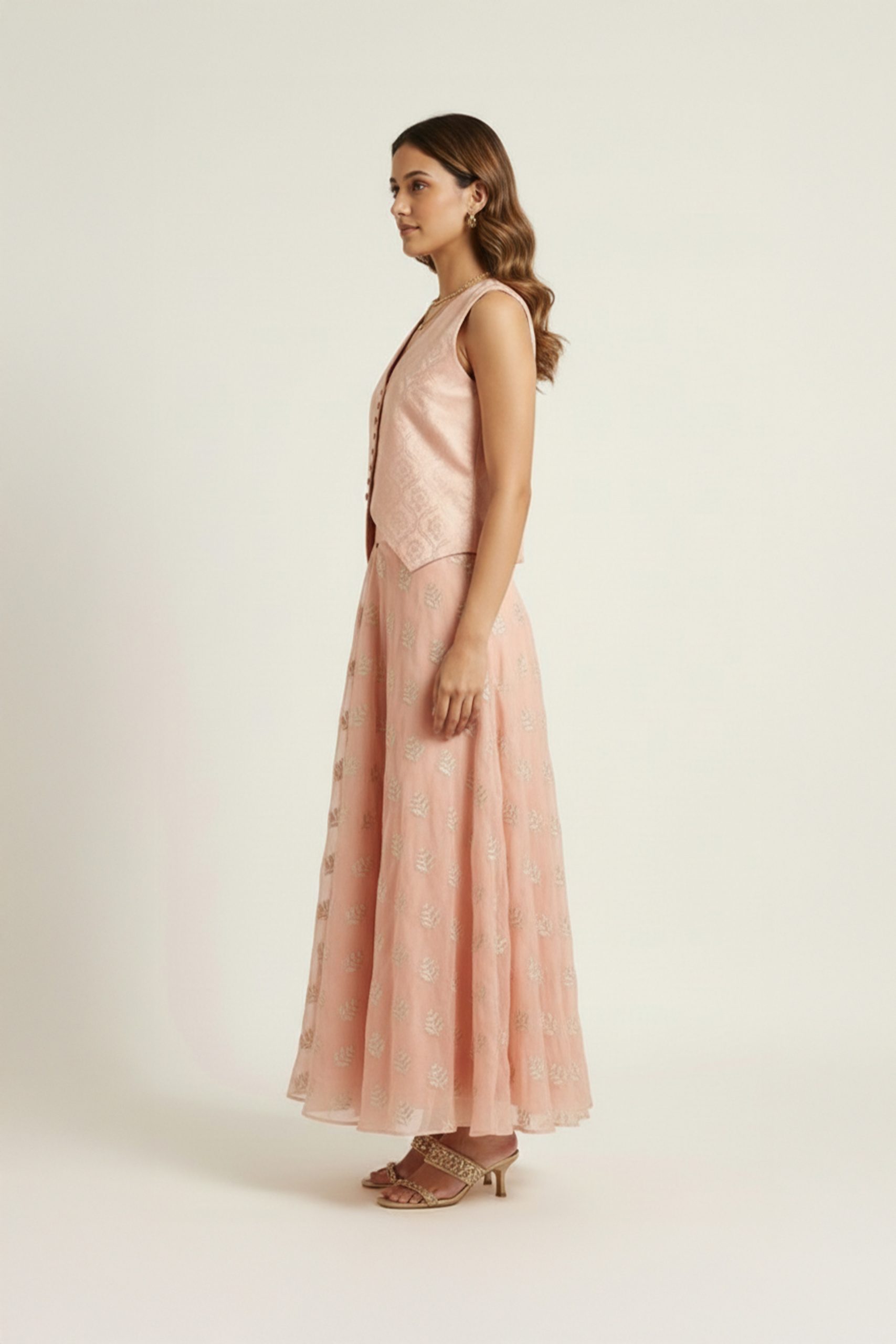 Peach embroidered jacket lehenga set with sleeveless V-neck jacket and flared lehenga