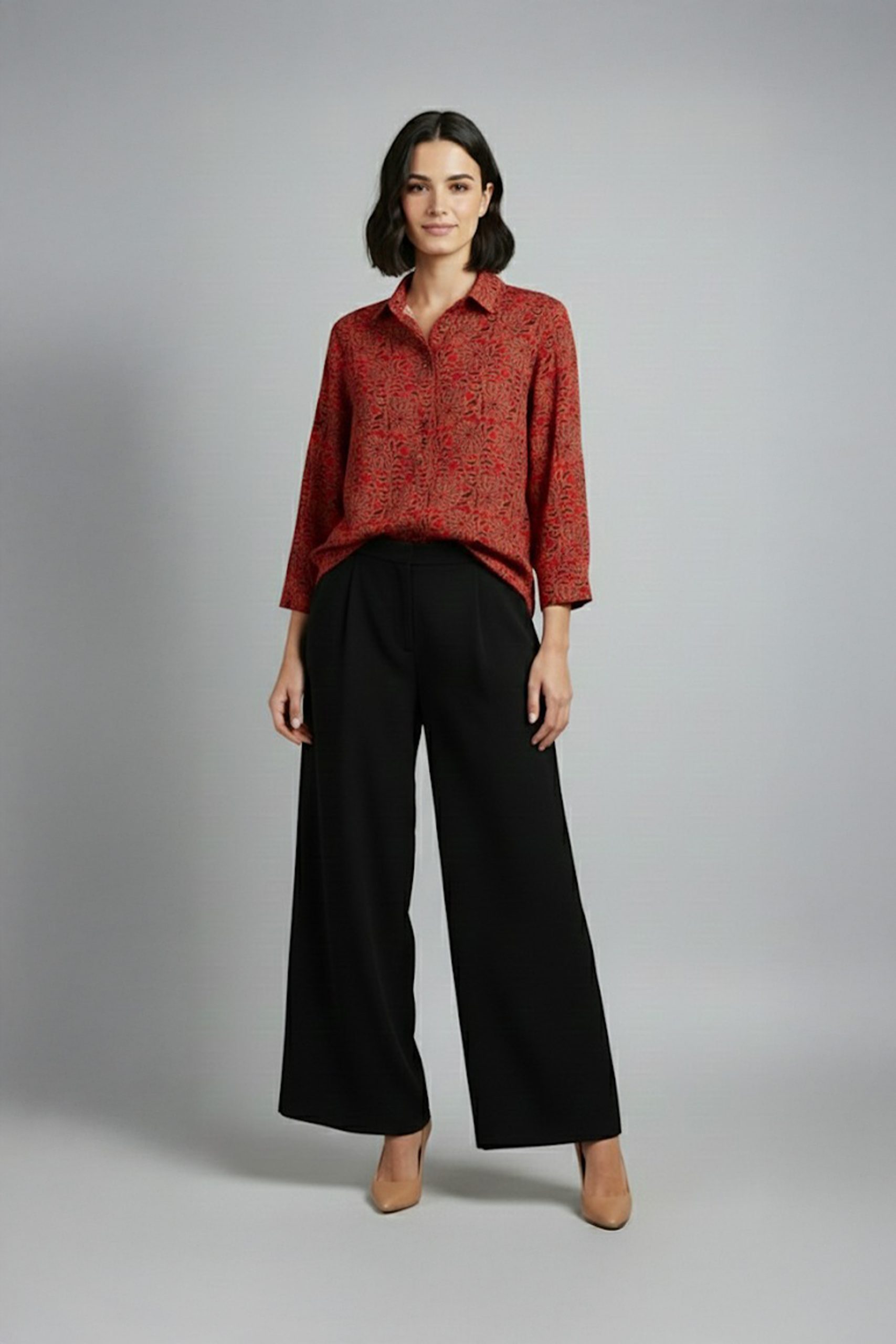 Woman wearing red printed co-ord set with wide-leg pants