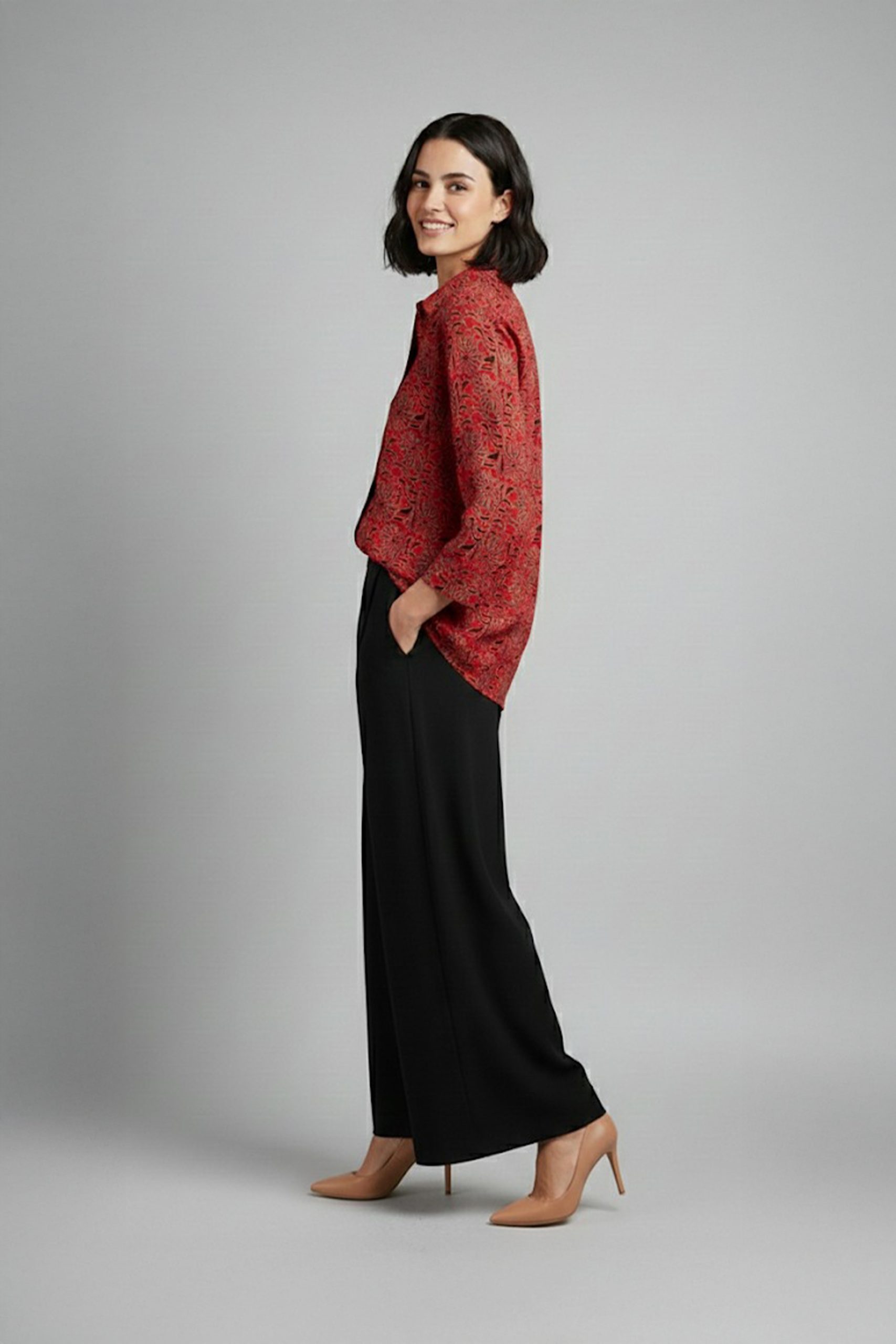 Woman wearing red printed co-ord set with wide-leg pants