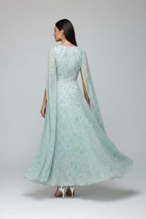 Pastel green floral cape sleeve maxi dress with round neckline and flowy A-line silhouette