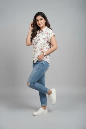 Cream floral shirt top for women with short sleeves and relaxed fit paired with blue jeans