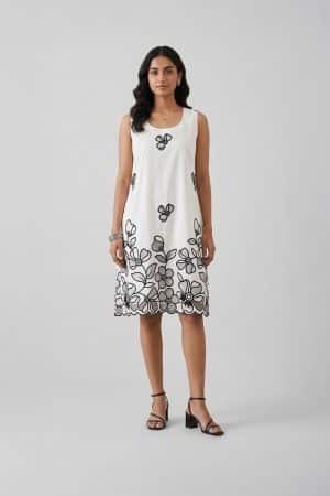 Elegant white sleeveless A-line dress with black floral embroidery and scalloped hem, perfect for summer brunch and resort wear.
