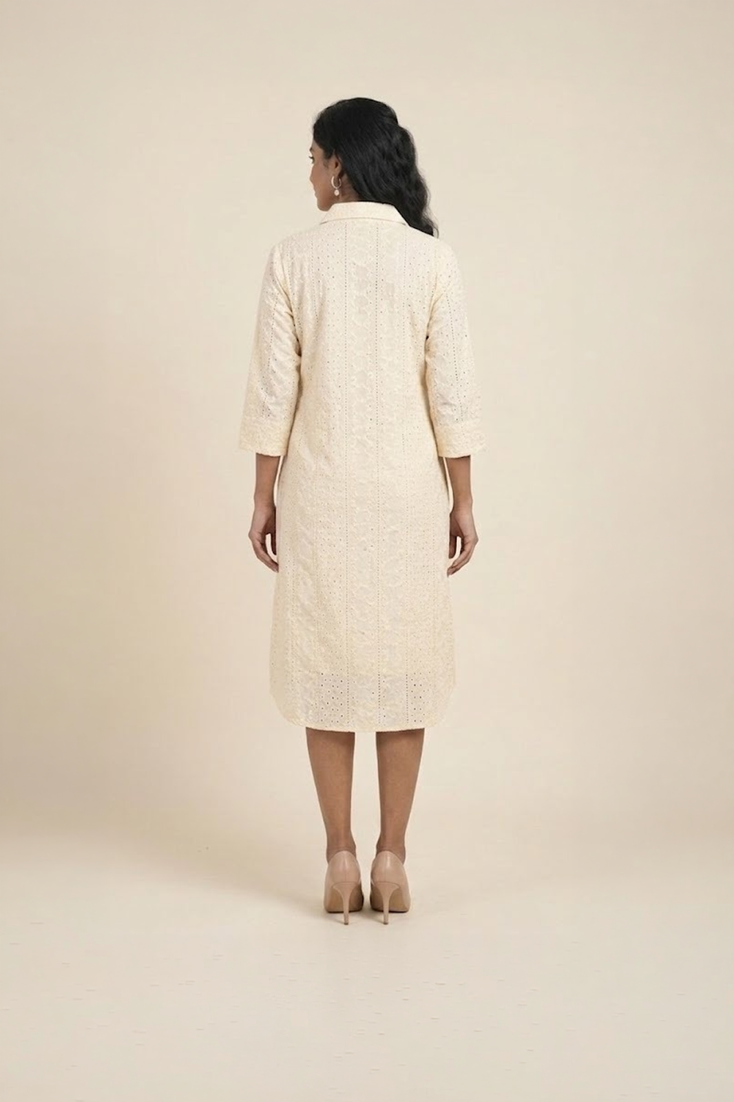 Woman wearing cream floral shirt dress with embroidered flowers – elegant women’s day dress