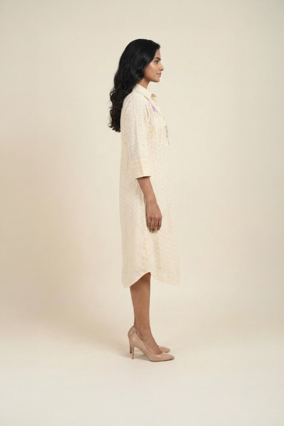 Woman wearing cream floral shirt dress with embroidered flowers – elegant women’s day dress