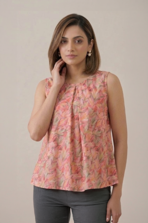 Peach Floral Pleated Top with sleeveless design and soft leaf print