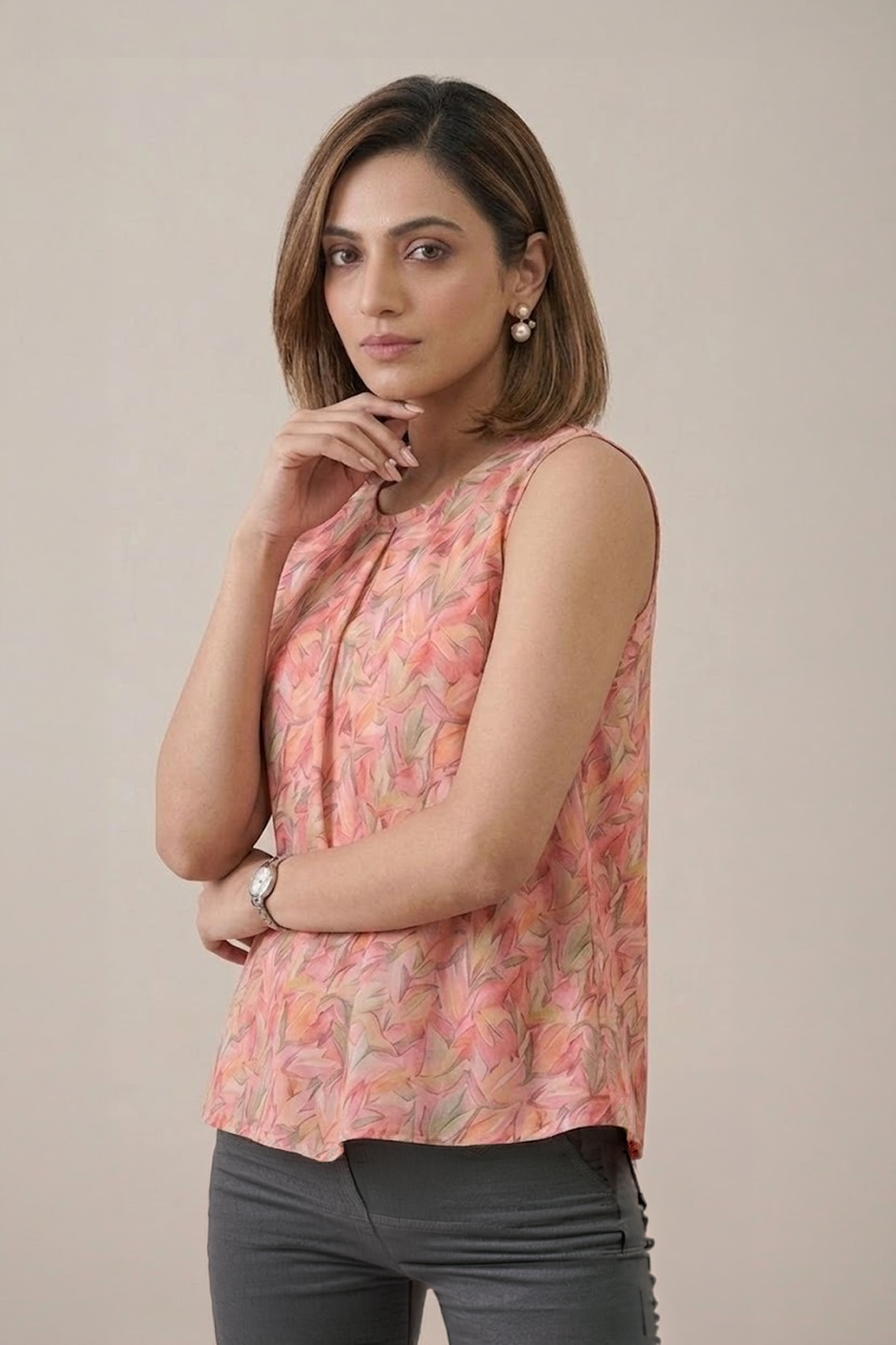 Peach Floral Pleated Top with sleeveless design and soft leaf print