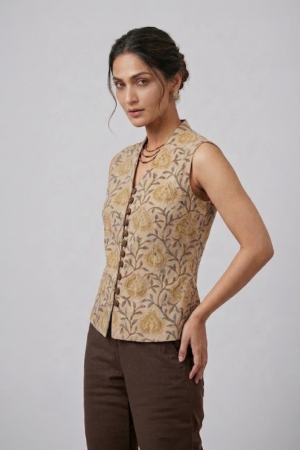 Mustard Floral Sleeveless Top with button-down front and brown trousers