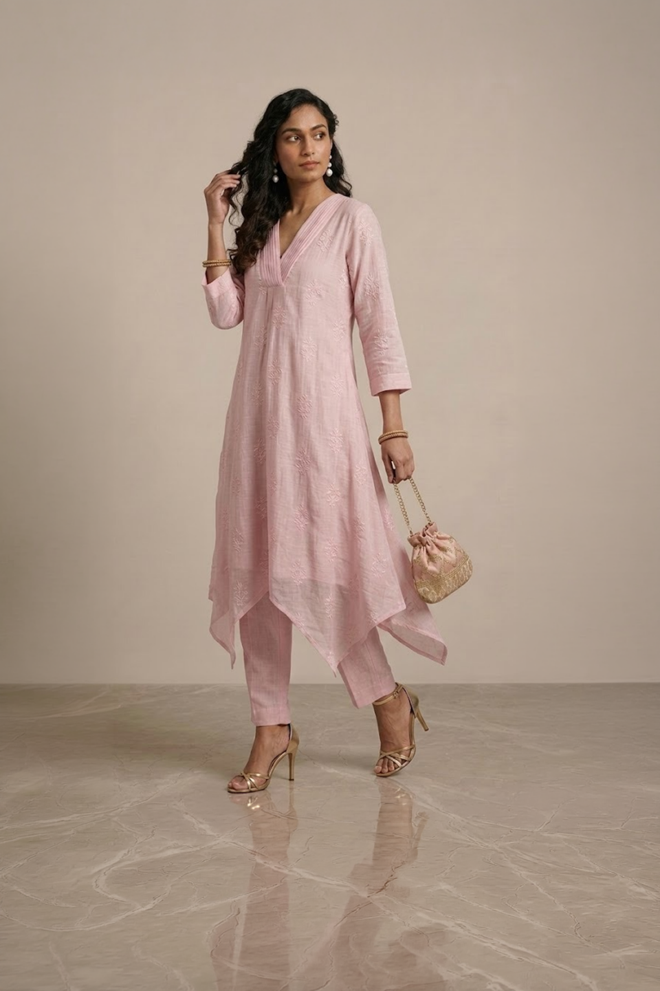 pink kurta set for women with asymmetrical hem and pants