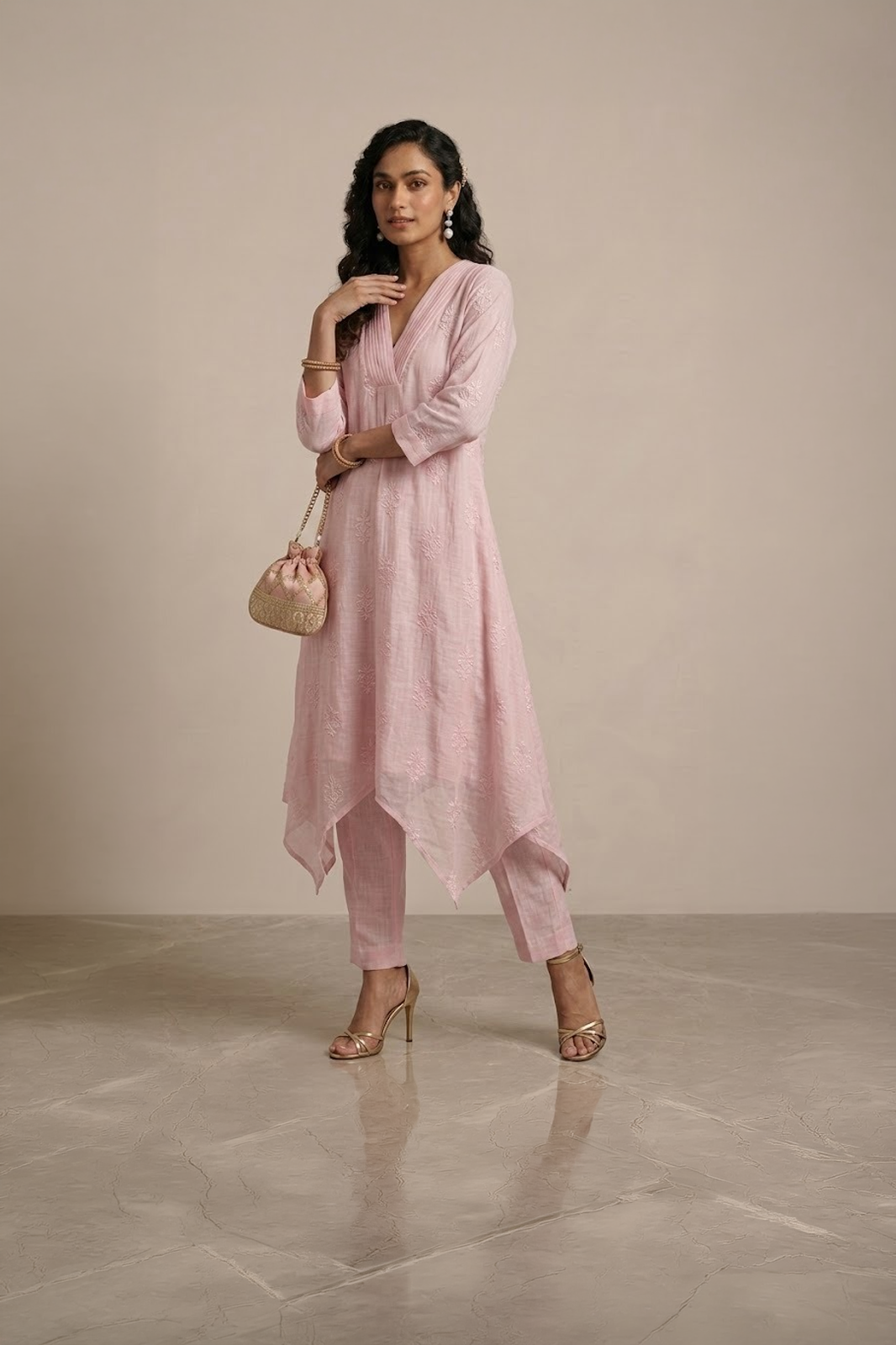 pink kurta set for women with asymmetrical hem and pants