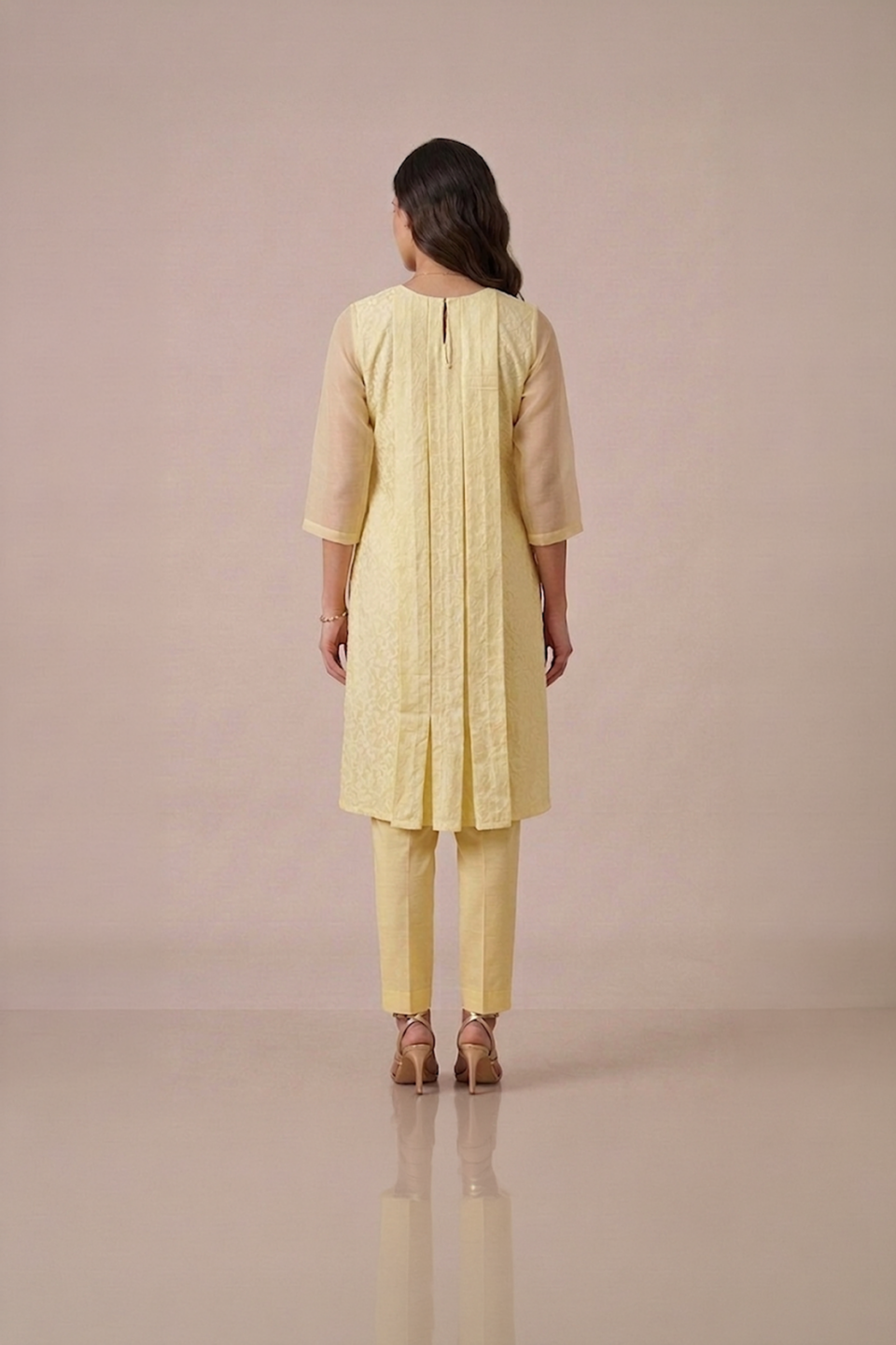 Yellow kurta set for women in pastel textured fabric with sheer sleeves and matching pants