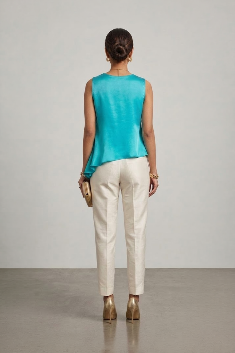 Turquoise sleeveless top with layered asymmetric hem
