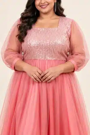 Close-up of the coral pink gown sequin bodice and sheer tulle fabric