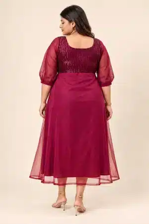 Back view of the Maroon Sequin Elegance Gown on a plus-size model, showing the sequinned bodice and sheer sleeves