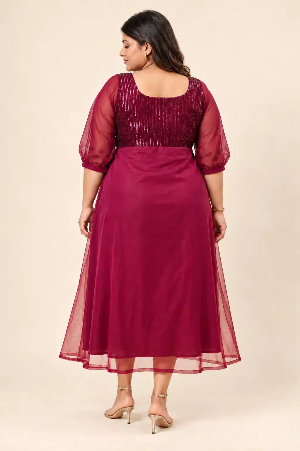 Back view of the Maroon Sequin Elegance Gown on a plus-size model, showing the sequinned bodice and sheer sleeves