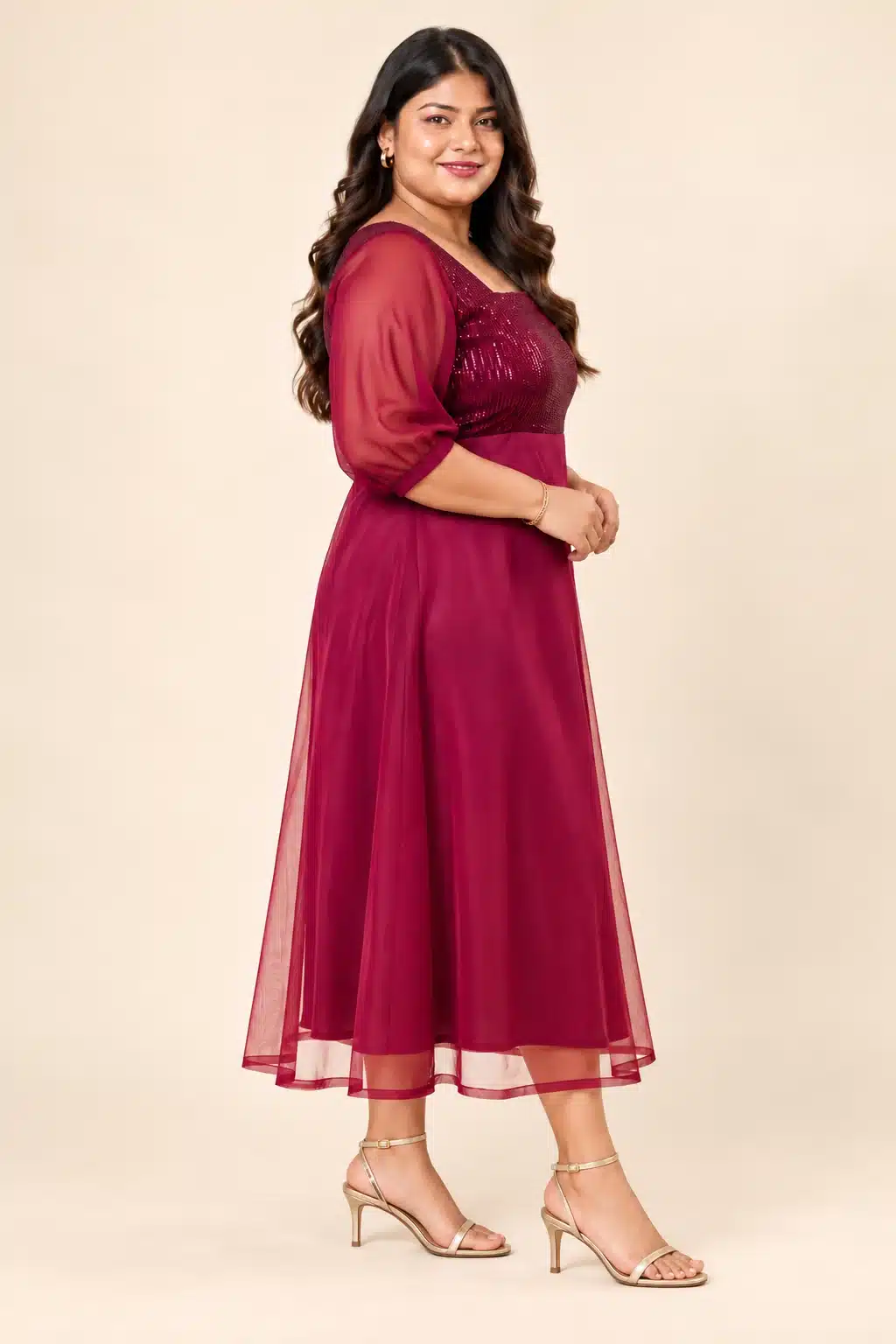 Side view of the Maroon Sequin Elegance Gown on a plus-size model with champagne-gold sandals