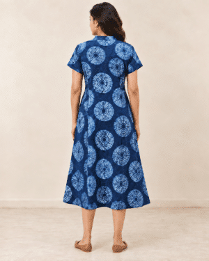Navy Shibori Dabu A-line dress, back view showing short sleeves and midi hem