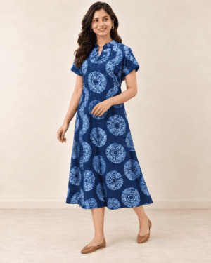 Navy Shibori Dabu A-line dress, front walking pose showing the flared skirt