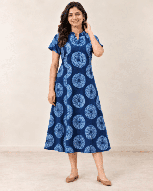 Navy Shibori Dabu A-line dress, front view with hand near hair