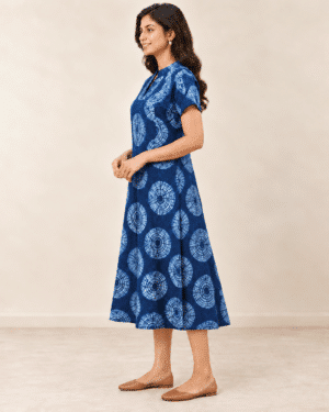 Navy Shibori Dabu A-line dress with light blue circular motifs, side view