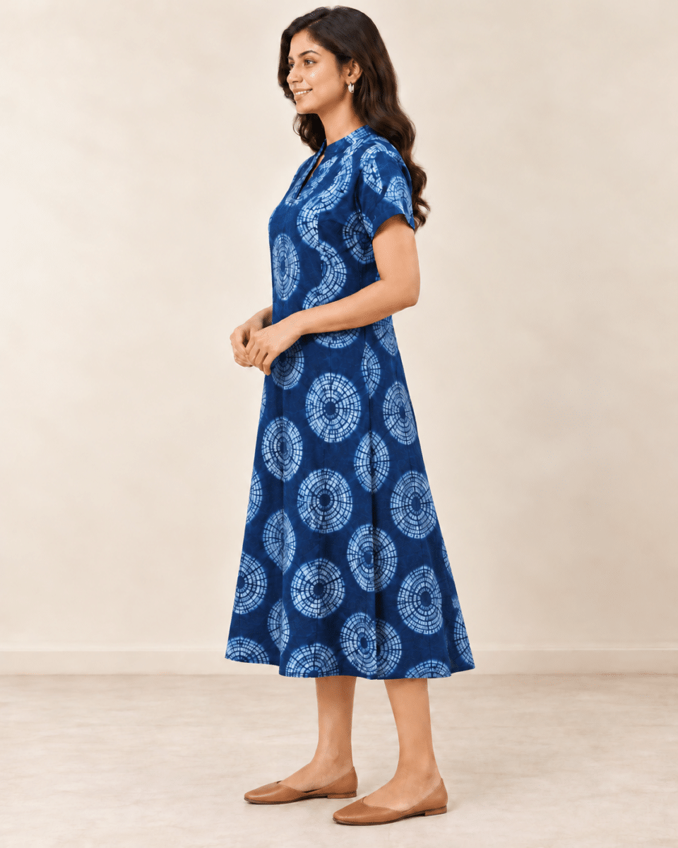 Navy Shibori Dabu A-line dress with light blue circular motifs, side view