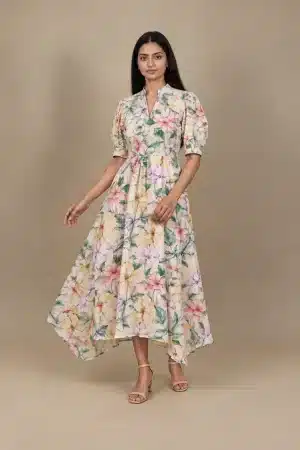 Pastel Floral High Low Dress in beige with multicolour flowers, movement view showing the flowing high-low skirt.