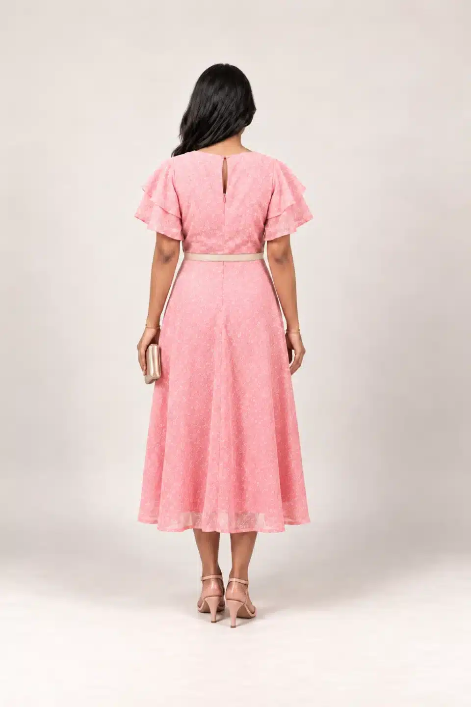 Soft pink flutter sleeve midi dress, back view showing keyhole neckline and champagne styling belt